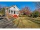 Brick home with sunroom and red steps at 1366 Emory Ne Rd, Atlanta, GA 30306