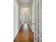 Long hallway with hardwood floors and classic trim at 1366 Emory Ne Rd, Atlanta, GA 30306