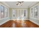 Bright living room with hardwood floors, large windows, and traditional molding at 1366 Emory Ne Rd, Atlanta, GA 30306
