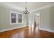 Living room with a chandelier and door leading into a kitchen at 1366 Emory Ne Rd, Atlanta, GA 30306