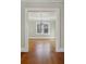 View of living room with hardwood floors and view into another room at 1366 Emory Ne Rd, Atlanta, GA 30306
