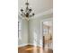 Living room with a chandelier and door leading into a kitchen at 1366 Emory Ne Rd, Atlanta, GA 30306