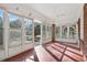 Bright sunroom featuring floor-to-ceiling windows and brick accents at 1366 Emory Ne Rd, Atlanta, GA 30306