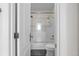 Clean bathroom with white subway tiles and gold fixtures at 3475 Oak Valley Rd # 2820, Atlanta, GA 30326