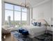 Spacious bedroom boasts a king-size bed, large windows, and city views at 3475 Oak Valley Rd # 2820, Atlanta, GA 30326