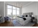 Primary bedroom with a king-size bed and city views at 3475 Oak Valley Rd # 2820, Atlanta, GA 30326