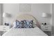 Serene bedroom with a white bed and stylish blue pillows at 3475 Oak Valley Rd # 2820, Atlanta, GA 30326