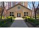 Charming clubhouse with well-maintained landscaping and exterior lighting at 3475 Oak Valley Rd # 2820, Atlanta, GA 30326