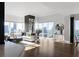 Bright living room with hardwood floors and city views at 3475 Oak Valley Rd # 2820, Atlanta, GA 30326