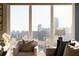 Living room with city views from large windows at 3475 Oak Valley Rd # 2820, Atlanta, GA 30326