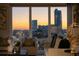 Living room with stunning city skyline view at sunset at 3475 Oak Valley Rd # 2820, Atlanta, GA 30326
