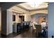 Upscale lounge area with a bar, dining tables, and comfortable seating for residents at 3475 Oak Valley Rd # 2820, Atlanta, GA 30326