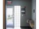 A pool entrance featuring an exit sign, pool rules, a drinking fountain, and an accessible door to the pool area at 3475 Oak Valley Rd # 2820, Atlanta, GA 30326