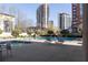 Resort-style pool area offers residents relaxation with lounge chairs and shade at 3475 Oak Valley Rd # 2820, Atlanta, GA 30326