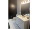 Modern bathroom with a white vanity, hexagon tile, and gold fixtures at 870 Mayson Turner Nw Rd # 1102, Atlanta, GA 30314