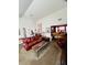 Open living room with a leather sofa and view into another room at 405 Pecan Wood, Fairburn, GA 30213