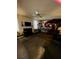 Living room with sectional sofa and a fireplace at 405 Pecan Wood, Fairburn, GA 30213