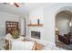 Cozy living room featuring a fireplace with a wooden mantel and a decorative hutch at 436 Westlake Dr, Marietta, GA 30064