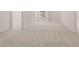 Spacious hallway with neutral carpeting at 5423 Flat Rock Pt, Stonecrest, GA 30038