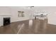 Spacious living room with hardwood floors and fireplace, open to kitchen at 5423 Flat Rock Pt, Stonecrest, GA 30038