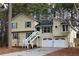 Two-story house with a two-car garage and a white staircase at 618 Amberwood Pl, Kingston, GA 30145