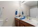 Bathroom features double sinks, wood cabinets and a large mirror at 1801 Liberty Nw Pkwy, Atlanta, GA 30318