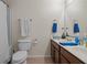Bathroom boasts double sinks, wood cabinets and a shower and tub combo at 1801 Liberty Nw Pkwy, Atlanta, GA 30318