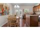 Dining area adjacent to the kitchen featuring hardwood floors and doors to outside at 1801 Liberty Nw Pkwy, Atlanta, GA 30318