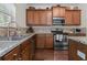 Functional kitchen with stainless steel appliances, granite countertops, and wood cabinetry at 1801 Liberty Nw Pkwy, Atlanta, GA 30318