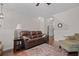 Comfortable living room with hardwood floors, neutral paint, and a view into the hallway at 1801 Liberty Nw Pkwy, Atlanta, GA 30318