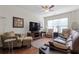 Inviting living room with hardwood floors, a ceiling fan, and plenty of natural light at 1801 Liberty Nw Pkwy, Atlanta, GA 30318