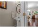 Well-maintained half bath with pedestal sink adjacent to the main living area at 1801 Liberty Nw Pkwy, Atlanta, GA 30318