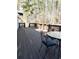 Outdoor deck with wooden flooring and views of trees and the neighborhood at 295 Whitby Dr, Douglasville, GA 30134