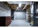 Unfinished basement with concrete walls and floor, storage shelves, and utility connections at 295 Whitby Dr, Douglasville, GA 30134