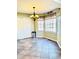 Dining area featuring a chandelier and natural light from the bay windows at 295 Whitby Dr, Douglasville, GA 30134