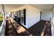 Spacious covered front porch with an outdoor seating area to enjoy the fresh air at 295 Whitby Dr, Douglasville, GA 30134