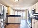 Bright kitchen with white cabinets, stainless steel appliances, and beautiful bay window area at 295 Whitby Dr, Douglasville, GA 30134