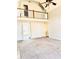 Bright open floor plan featuring a fireplace, carpet, and upstairs landing overlooking living area at 295 Whitby Dr, Douglasville, GA 30134