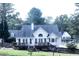 Beautiful home's rear exterior with a spacious deck and well-maintained yard at 295 Whitby Dr, Douglasville, GA 30134