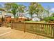 Spacious backyard with a wooden deck, lush green lawn, privacy fence, and mature trees, perfect for outdoor enjoyment at 1331 Walker Ave, Atlanta, GA 30344