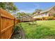 Wooden privacy fence encloses a yard, deck and gray painted outbuilding at 1331 Walker Ave, Atlanta, GA 30344