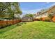 Spacious backyard featuring a charming deck, new fence, and lush green grass at 1331 Walker Ave, Atlanta, GA 30344