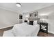 Comfortable bedroom with plush white bedding, dark wood floors, contemporary artwork, and matching nightstands at 1331 Walker Ave, Atlanta, GA 30344