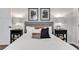 Cozy bedroom featuring a comfortable bed with stylish pillows, contemporary artwork, and coordinating nightstands at 1331 Walker Ave, Atlanta, GA 30344
