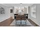 Dining area featuring stylish lighting, a view of the kitchen, and hardwood floors at 1331 Walker Ave, Atlanta, GA 30344