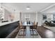 Open dining area with modern lighting, hardwood floors, and access to the living room at 1331 Walker Ave, Atlanta, GA 30344