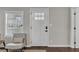 Bright entryway featuring a white front door, hardwood floors, and a neutral color scheme at 1331 Walker Ave, Atlanta, GA 30344