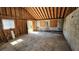 Unfinished garage interior featuring exposed framing, concrete floor, and cinder block walls at 1331 Walker Ave, Atlanta, GA 30344
