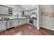 Modern kitchen with gray cabinets, stainless steel appliances, and hardwood floors at 1331 Walker Ave, Atlanta, GA 30344