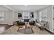 Well-lit living room with a neutral color palette, hardwood floors, and stylish decor at 1331 Walker Ave, Atlanta, GA 30344